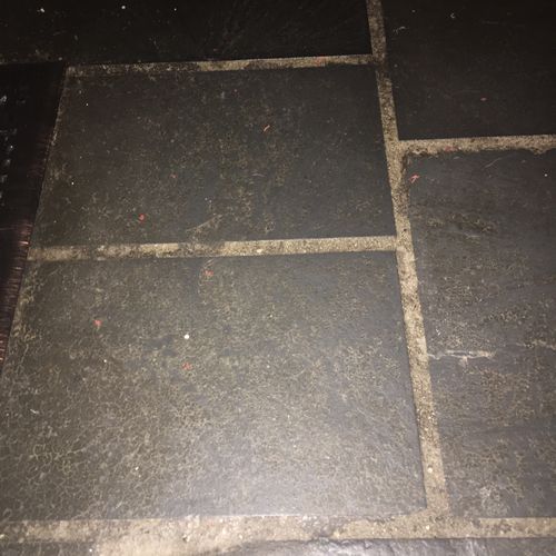Slate floor with years of waxy dirt
