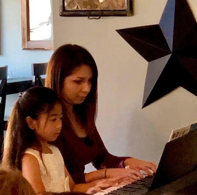 A student and I playing our duet at my Fall 2018 s