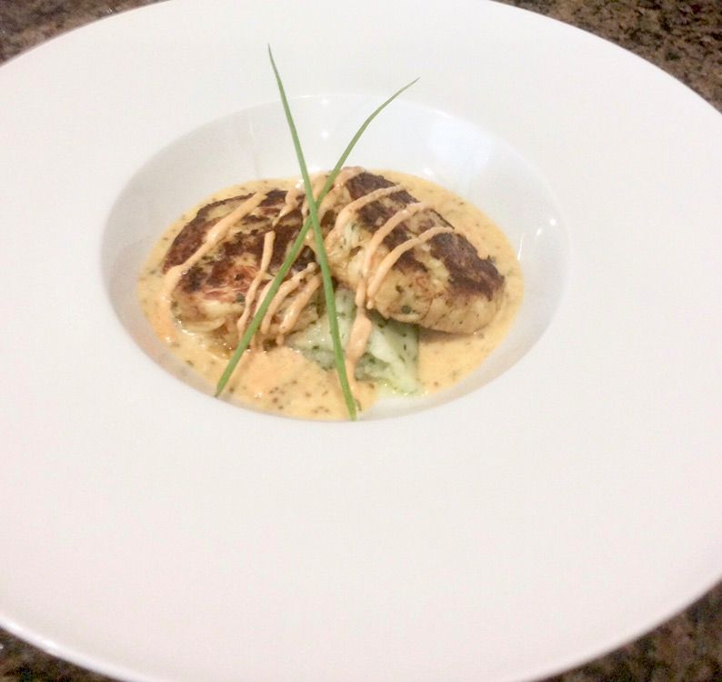 Jackfruit “crab” cakes over herbed potato purée an