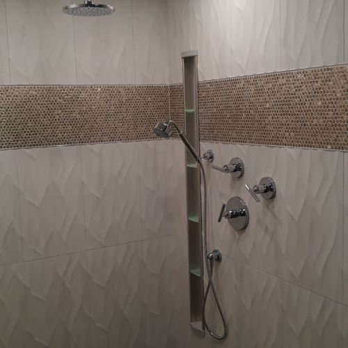 Master bathroom tile work with tall shampoo niche 