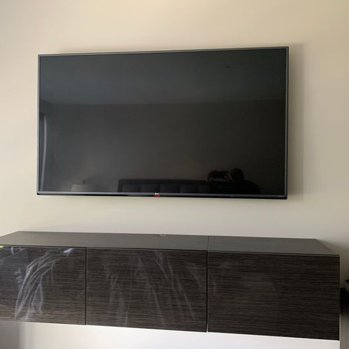 Mounted 75” tv with floating wall unit