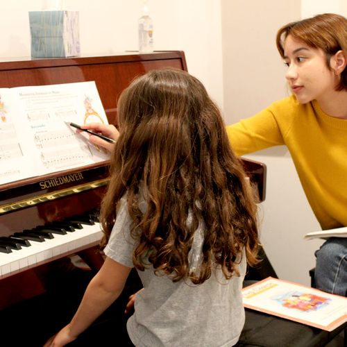 Instructor Vanessa teaching piano
