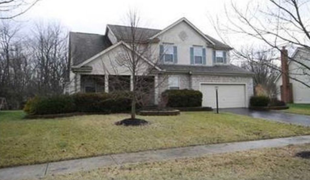 Before: Note the overgrown bushes, tired cement bl