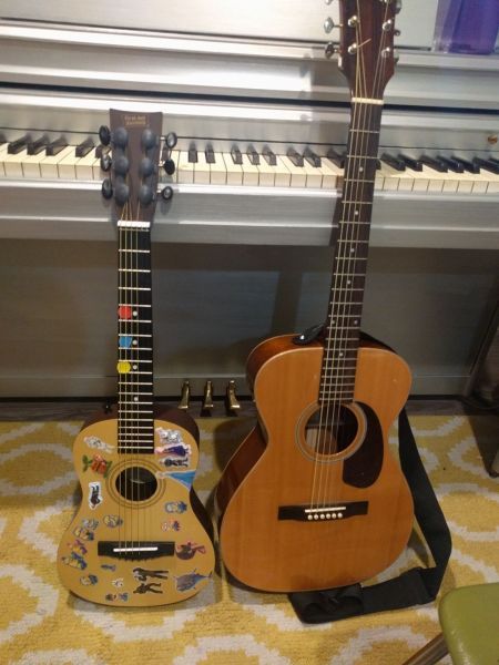 Students guitar with reward stickers next to mine!