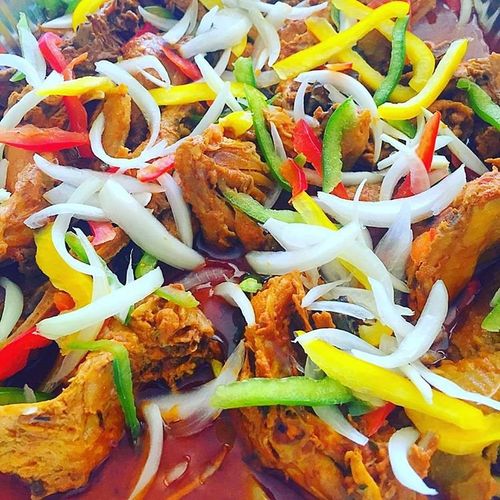 Stewed Chicken topped with Onions & Bell Peppers