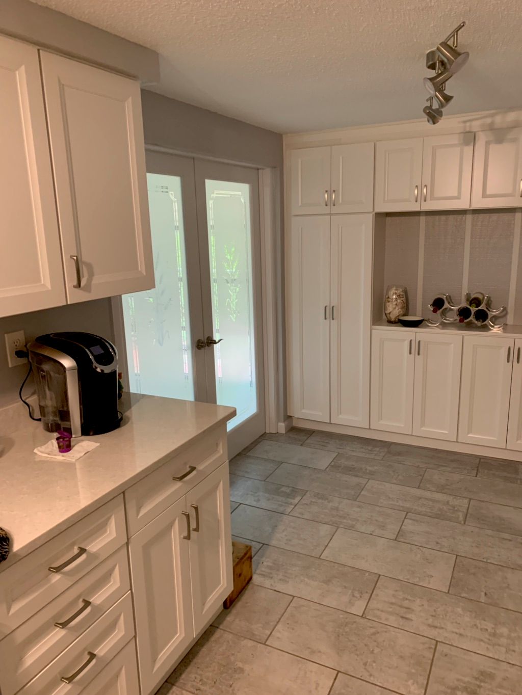 Cabinet installation and tile floors.
