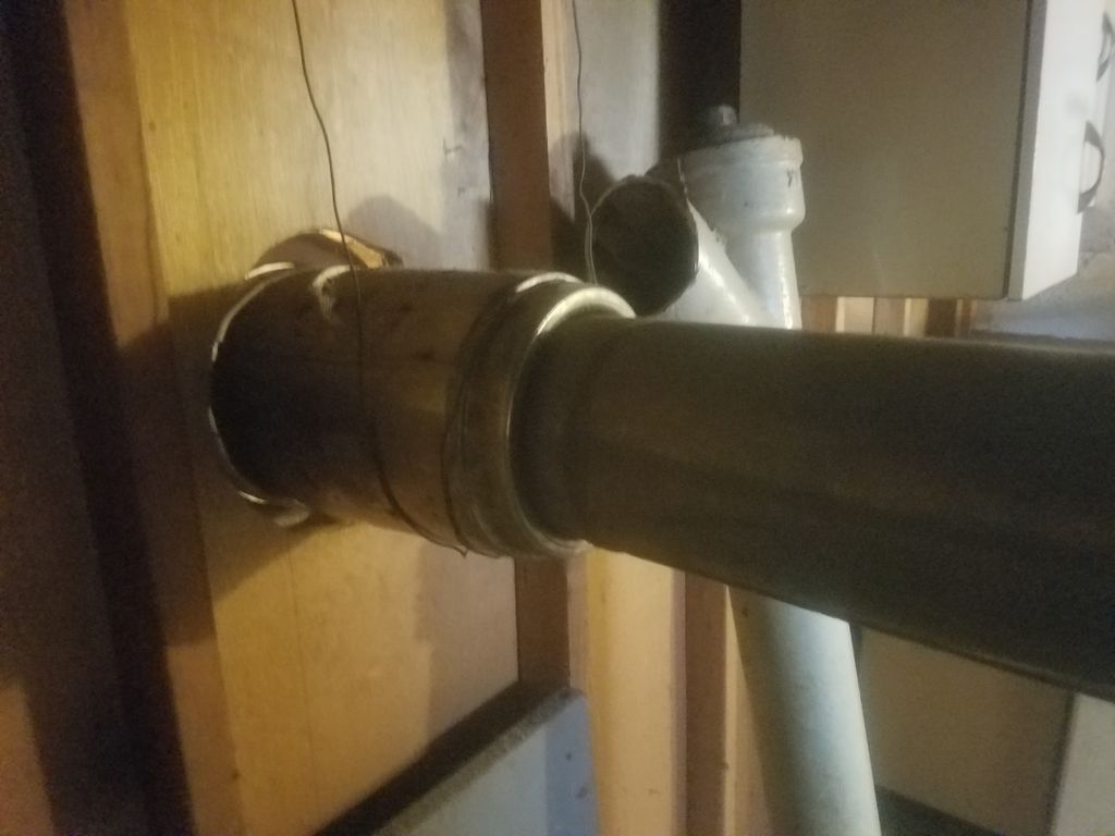 Furnace vented through wall.