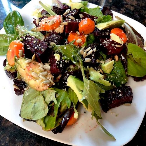 Summer beet salad topped with sunflower seeds and 
