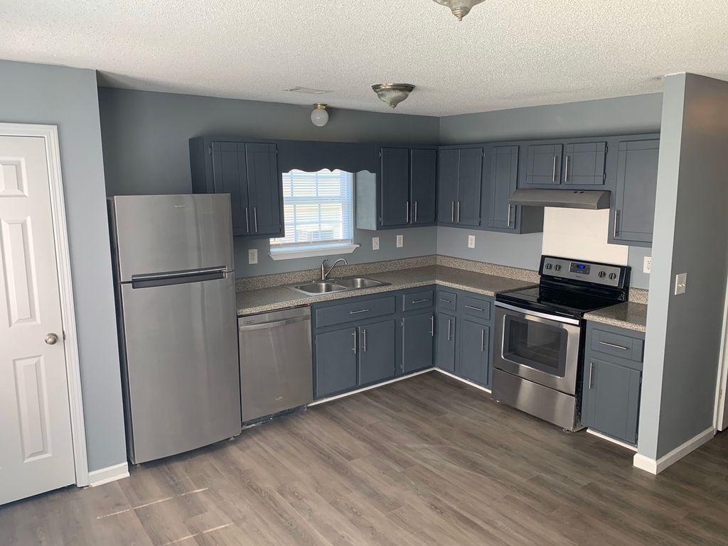 Refreshed kitchen: flooring, cabinets, paint