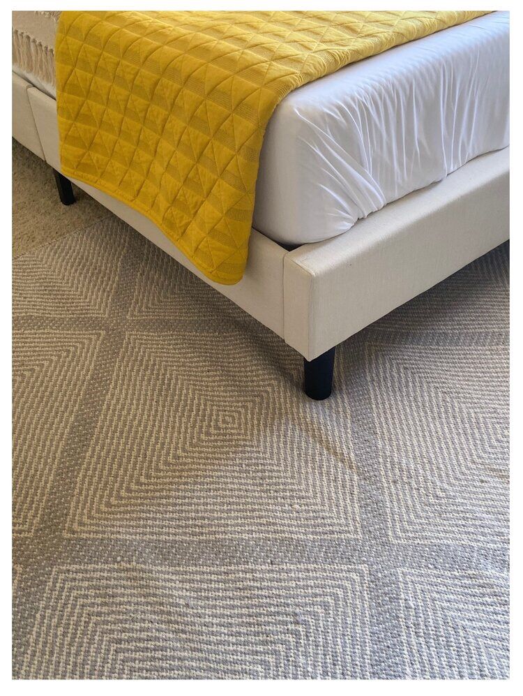 A soft, diamond pattern flatweave rug and textured