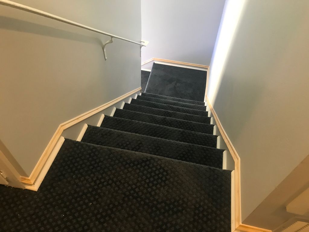 Stair trim installed as a "skirt board". 