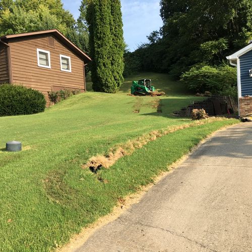Before Swale Cut, Runoff Through Retaining Wall In