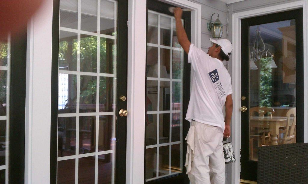 Top coat of paint on these 4 doors leading out ont