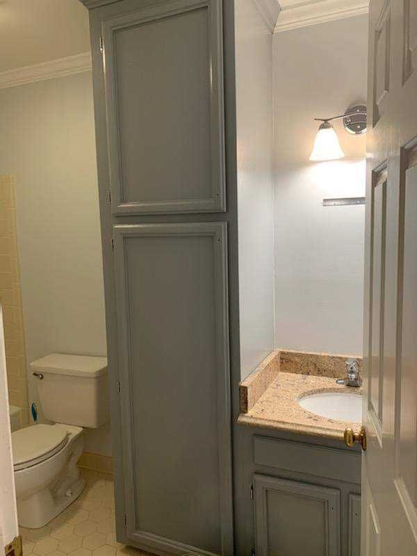 Linen cabinet and vanity refinished using Benjamin