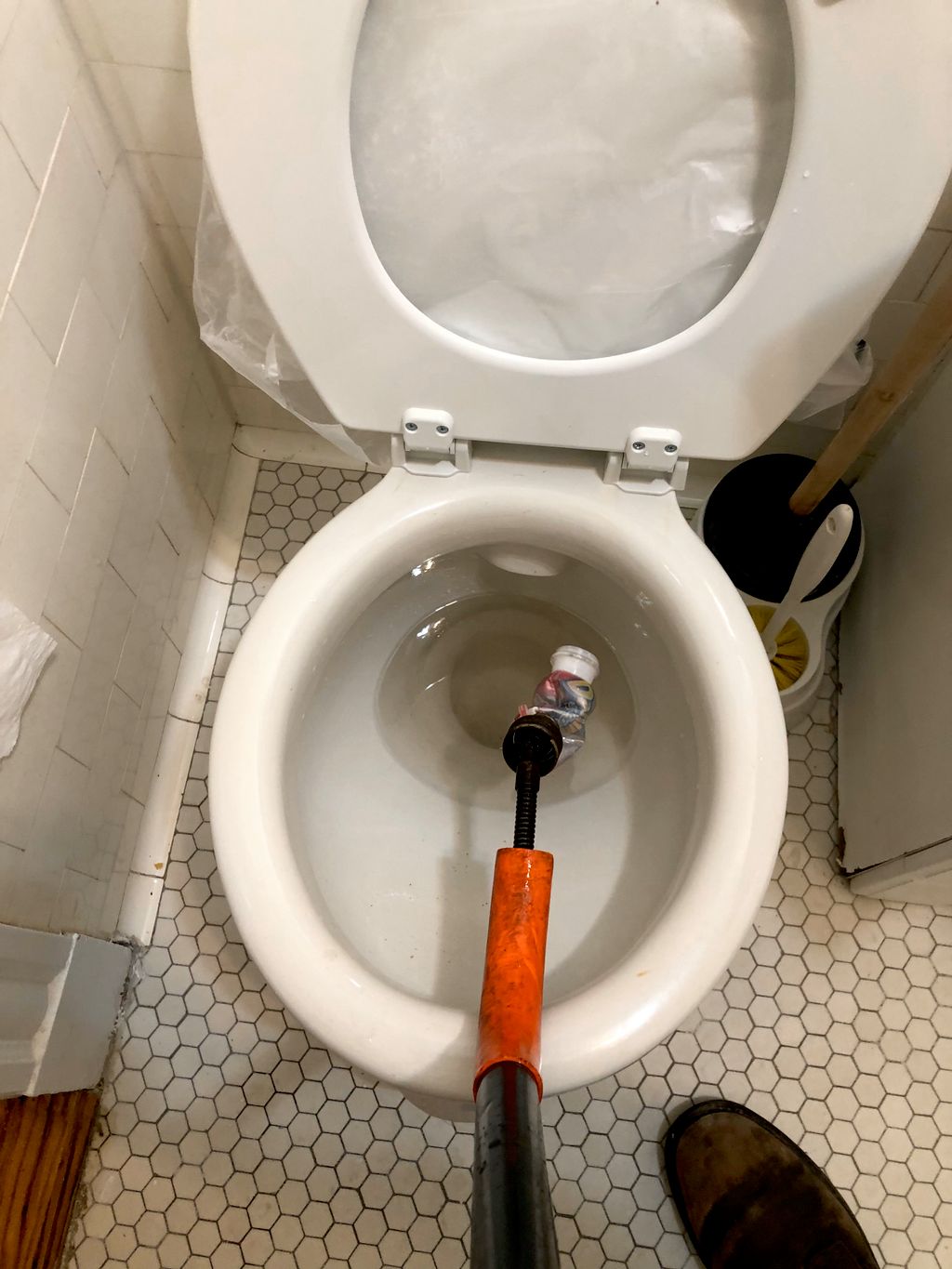 Retrieved foreign object out of toilet (plastic bo