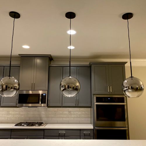 Greg quickly finished changing our pendant lights 
