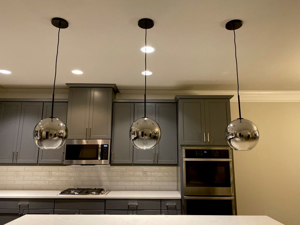 Greg quickly finished changing our pendant lights 