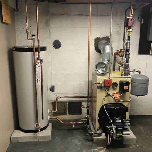 Oil fired boiler and storage tank