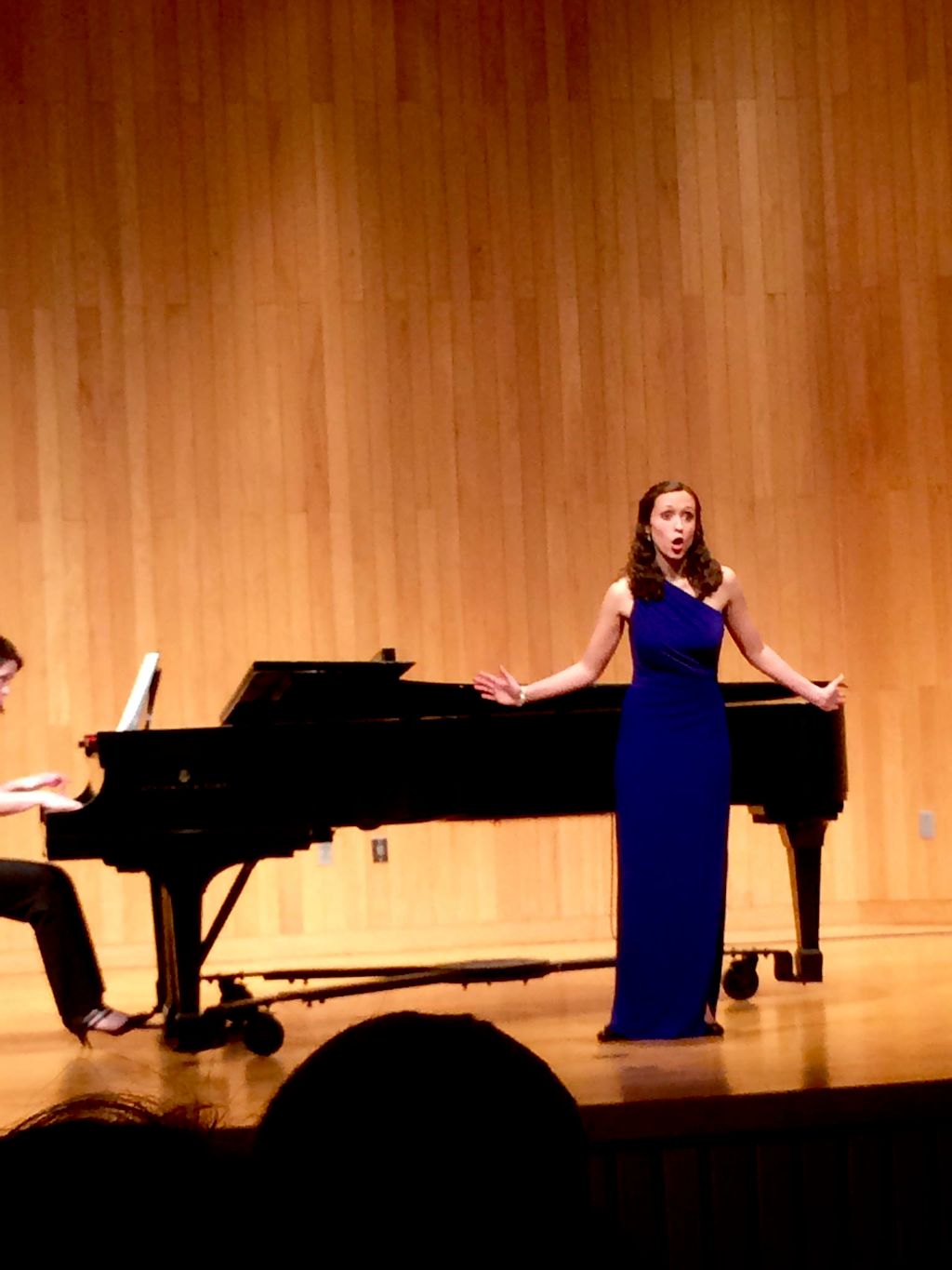 Singing a recital.