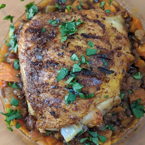 Berbere spiced chicken over lentil, carrot, and to