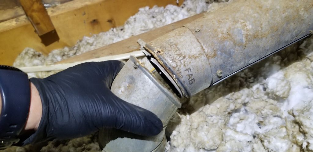 disconnected gas water heater flue venting in to a