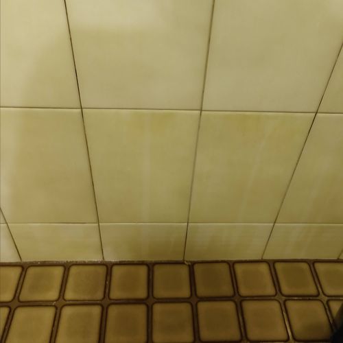 top tile clean bottom two tiles not.( the wall til