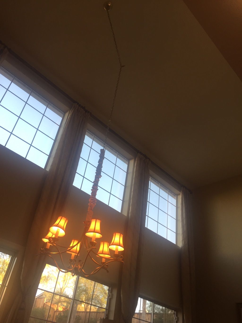 Living room with chandelier before lighting upgrad