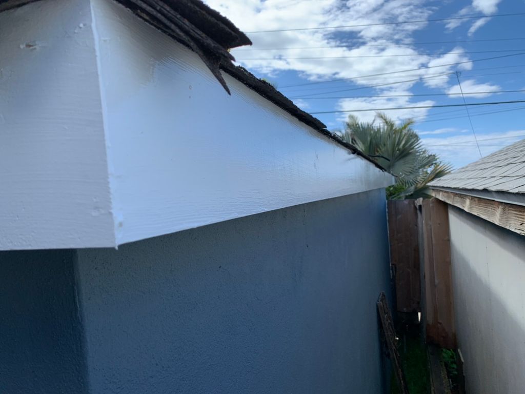 Replaced old termite eaten boards and painted