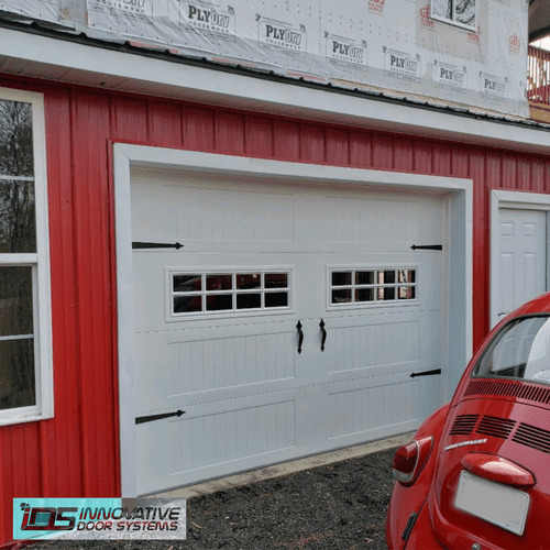 New single garage door with window inserts and str