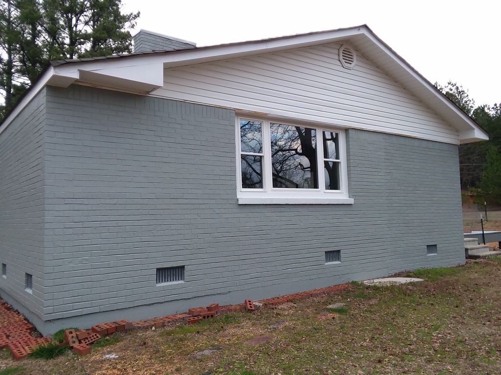 Gray and white brick house. Very sharp!