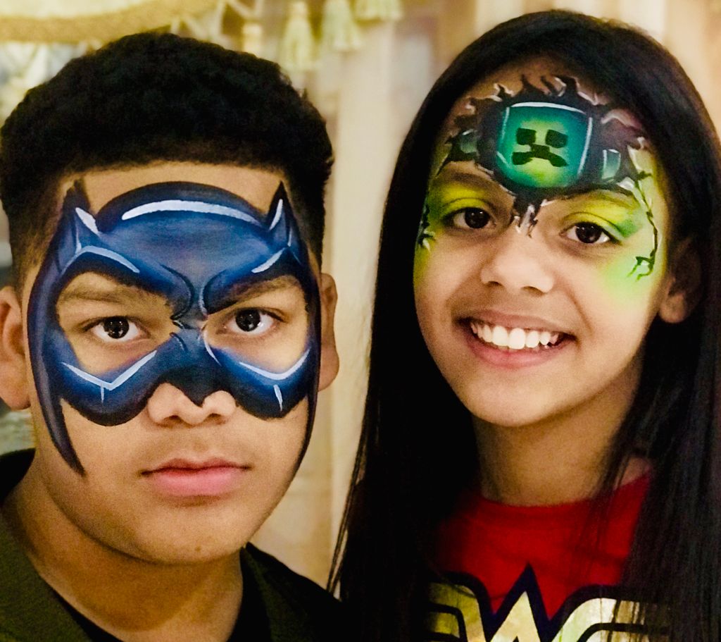 Superhero themed facepainting Batman and Minecraft
