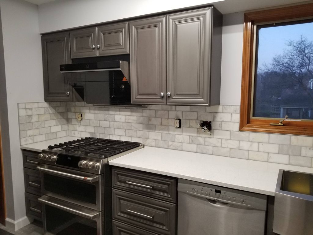 Marble backsplash install. Customer reinstalled el