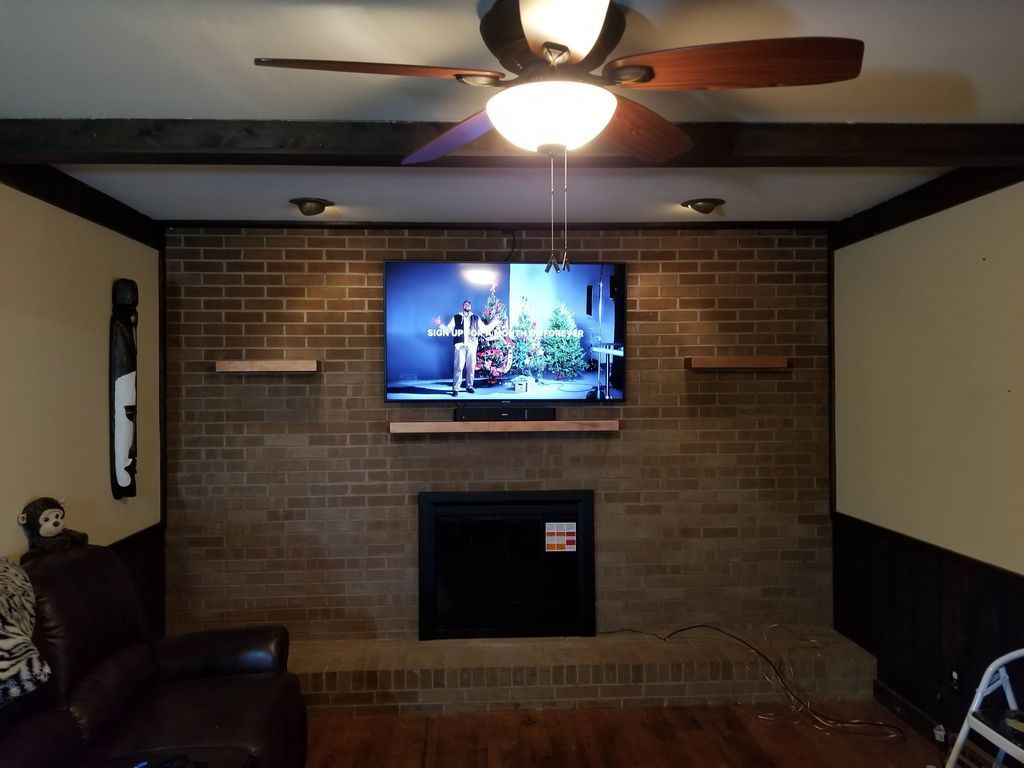 New fireplace front, and mounted tv, with new outl