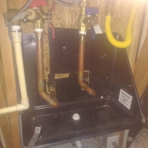 installed water drain pain for tankless water heat