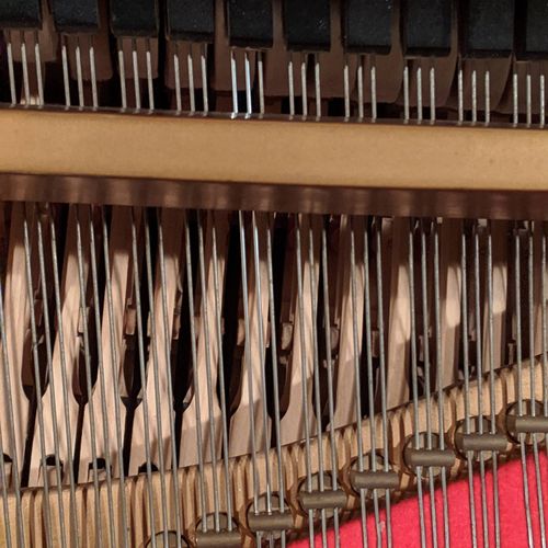 Treble wire re-string on a Steinway grand. 