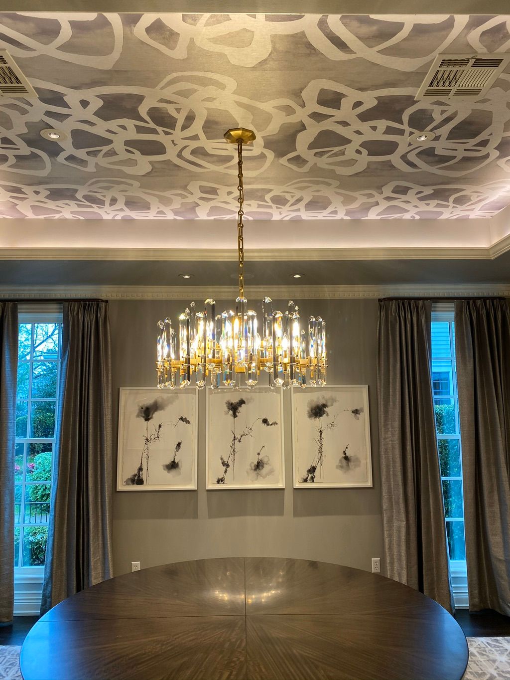 Cove ligthing and crystal chandelier.