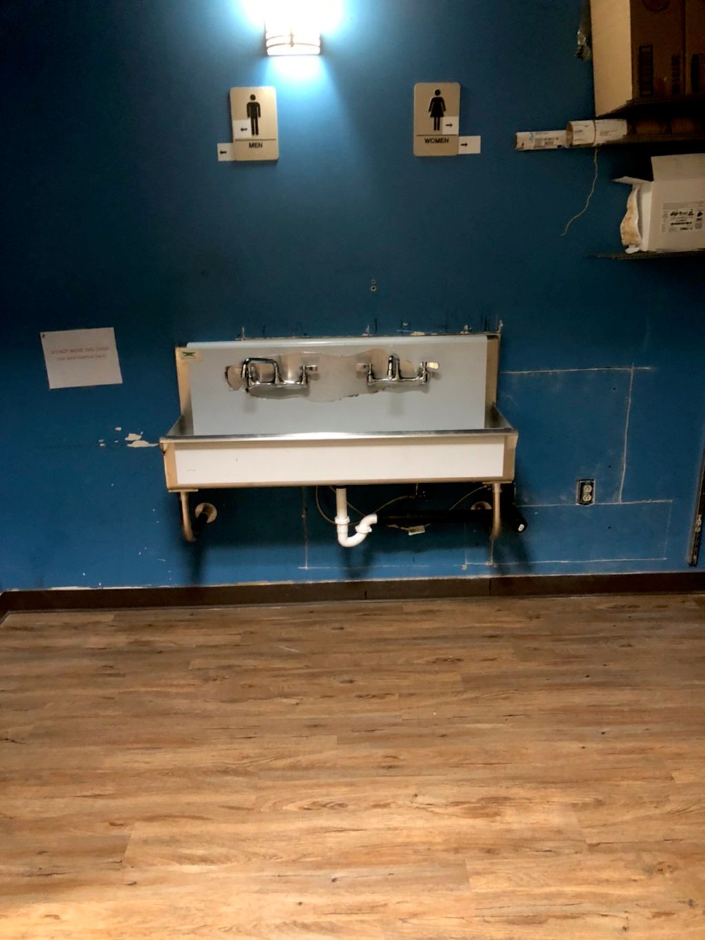 Wall hung, single compartment sink installed. 