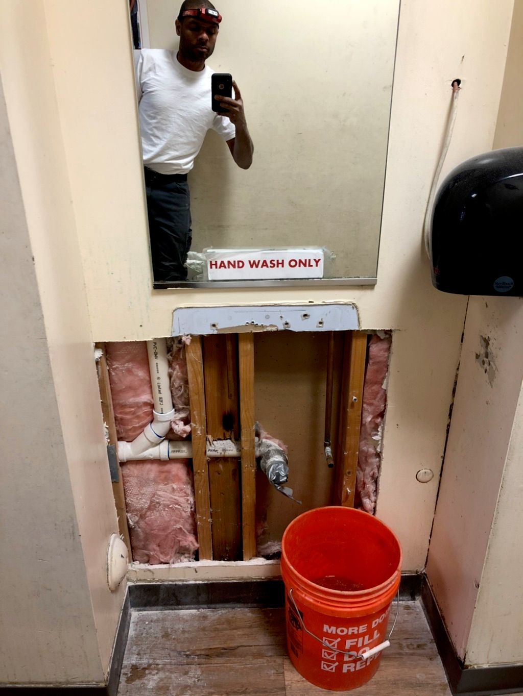 Hand sink removed, wall opened. 