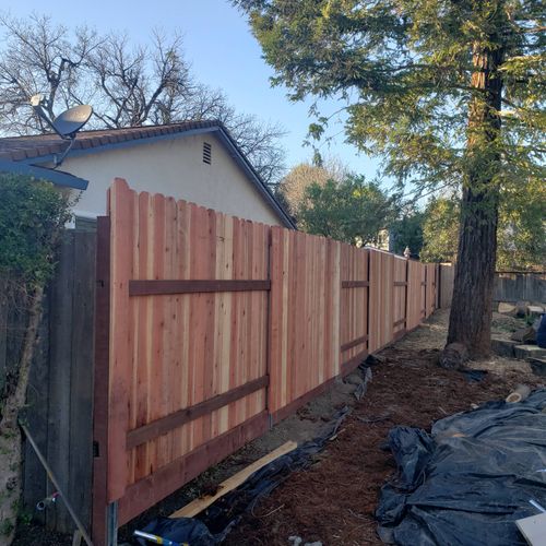 Replaced with steel posts, redwood pickets, pressu