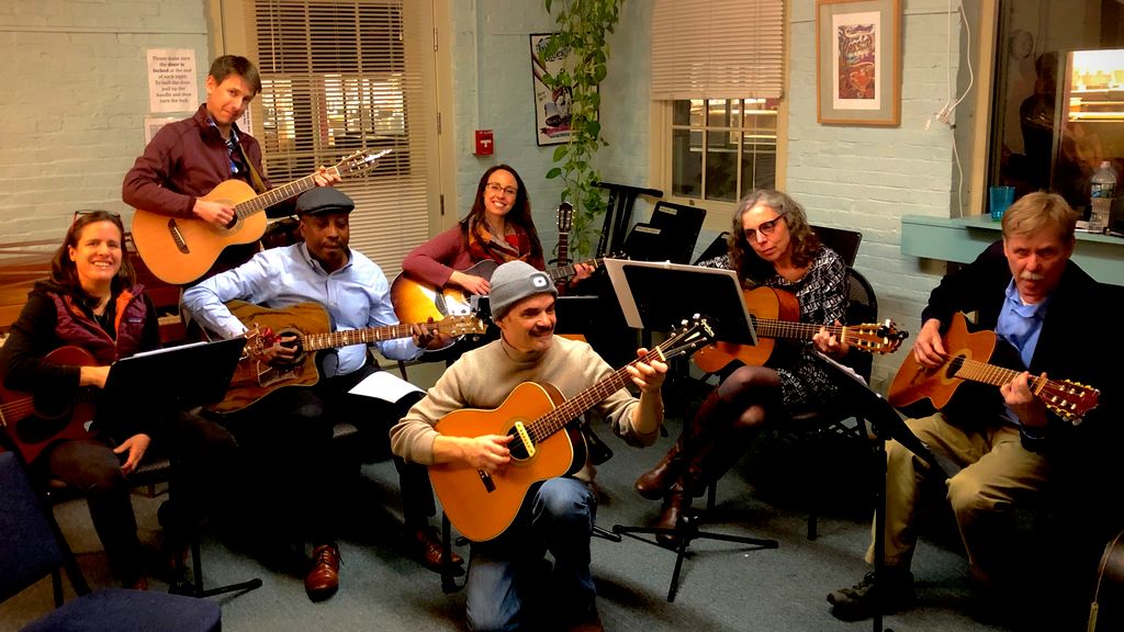 Finger-style groups class at Passim School of Musi