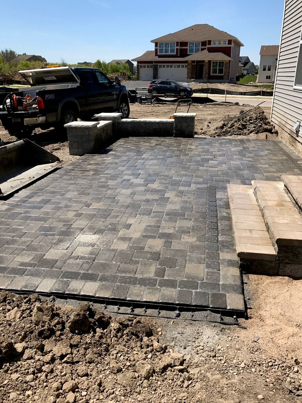 Cobble patio, seat wall and steps 