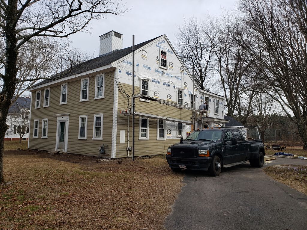 Installing Hardie plank siding on a 1750s colonial