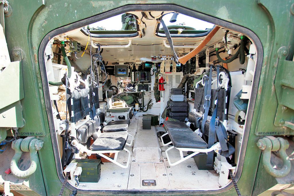 Troop seat for the Styker military vehicle