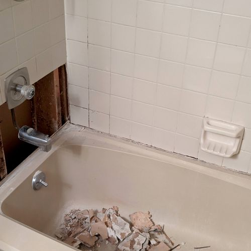 I had floor tile removed and my bathroom wall repa