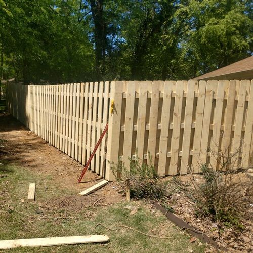 Removed overgrowth and replaced fence