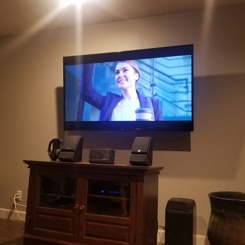 Adam mounted a 65” screen TV on the wall. He calle