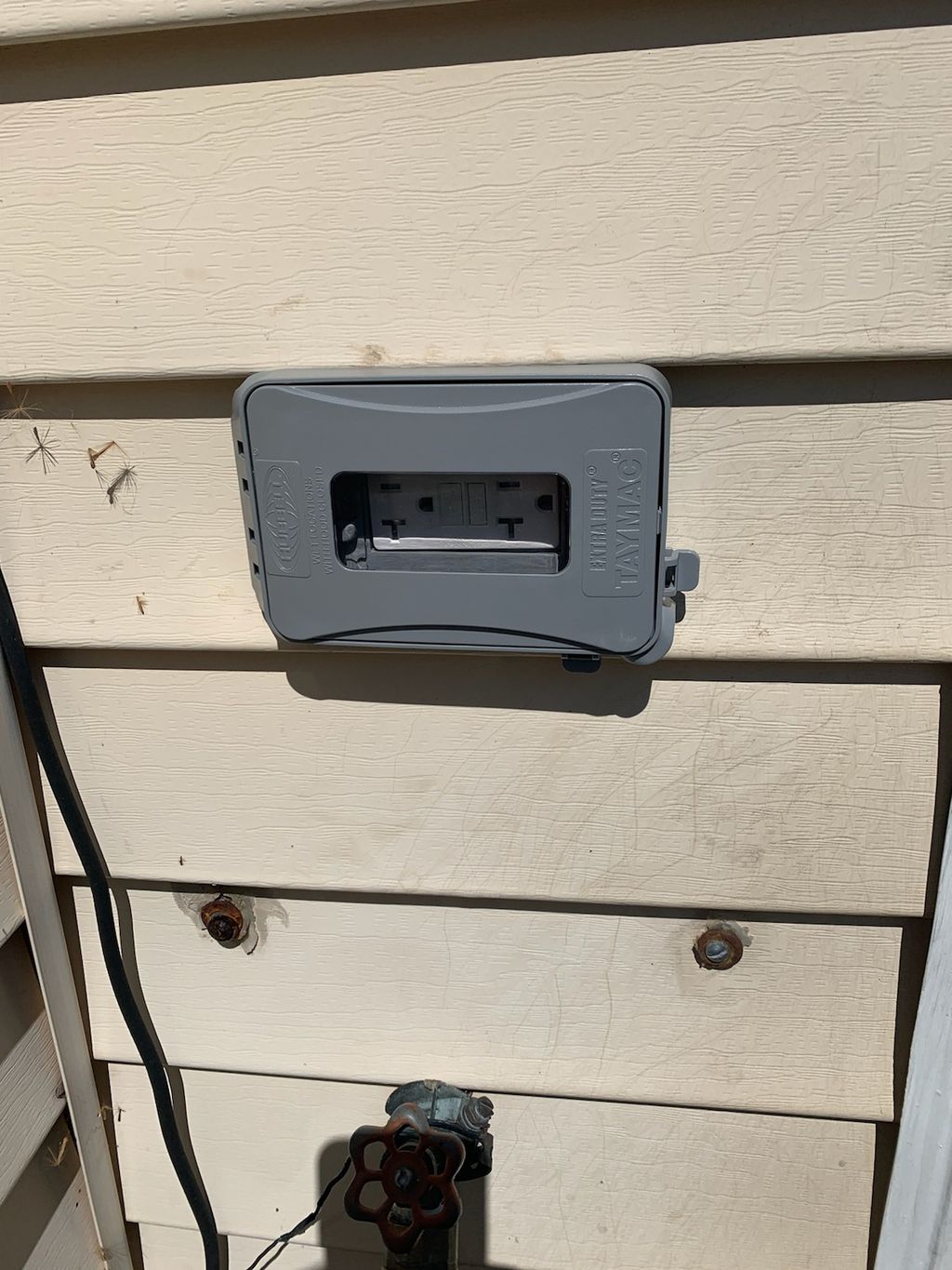 Outdoor outlet installation. 
