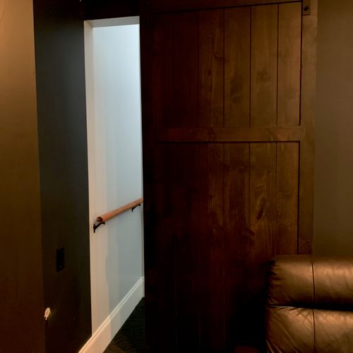 Holmes installed a Barn Door in my TV room.  The B