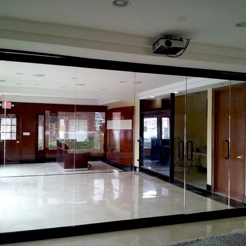 Sliding accordion glass door system. Commercial in