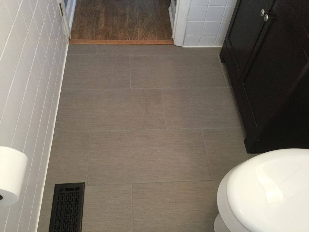 Install tile in bathroom.
